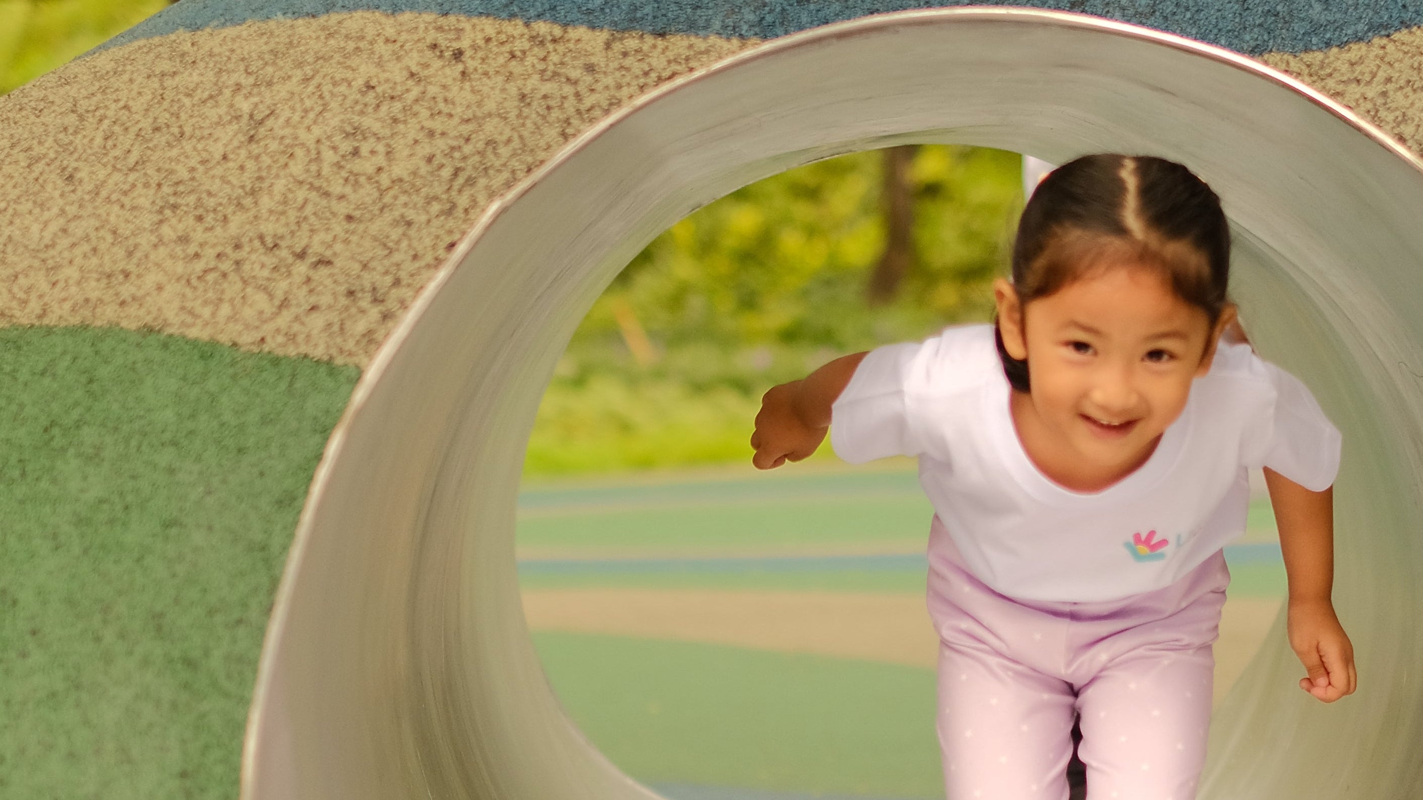 Little Warriors Preschool student playing at Ayala Triangle Play Forest in Makati / Child playing at the park