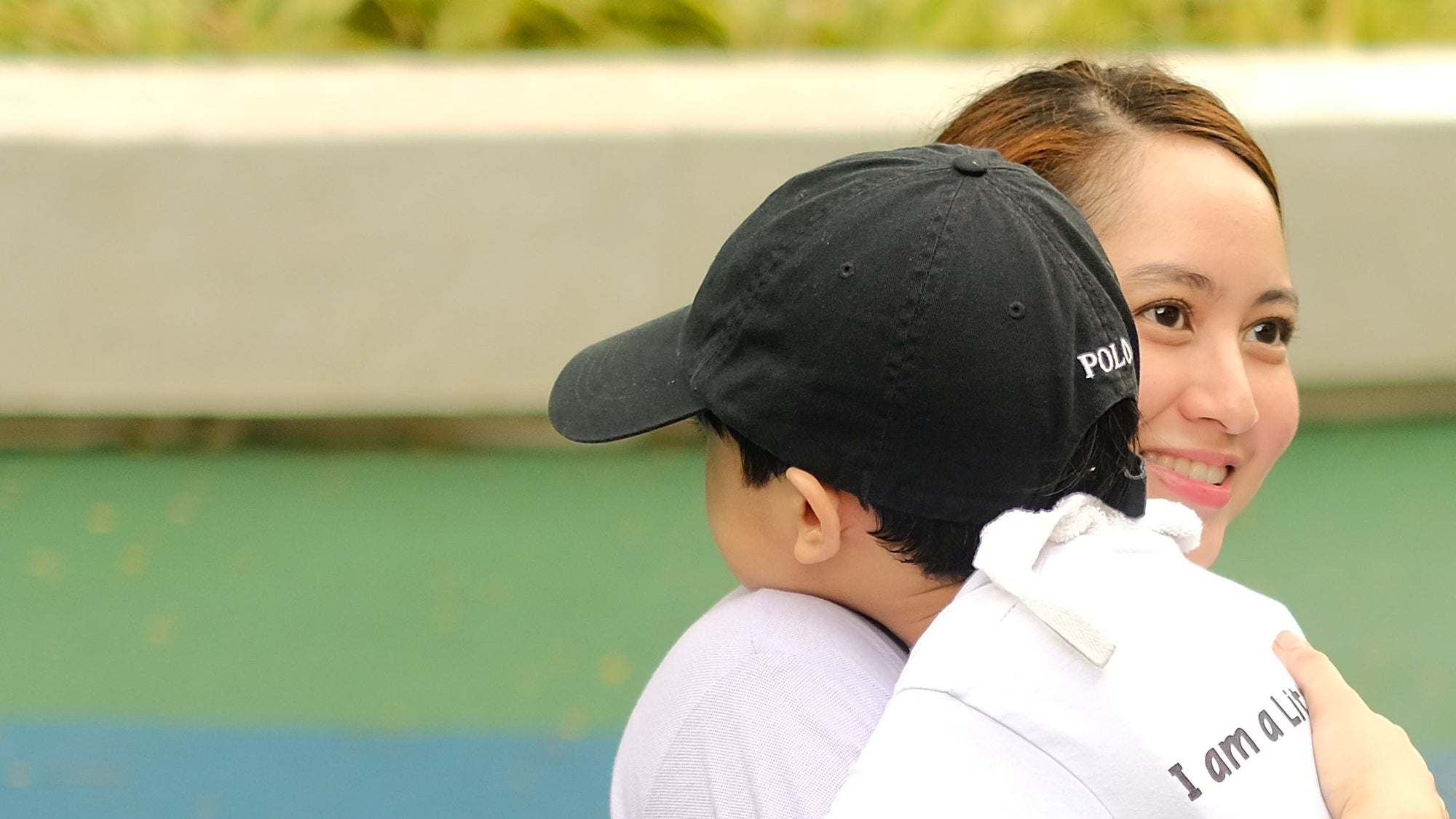 Teacher Mimi (Miranda Avellana) and student of Little Warriors Preschool shares a hug at Ayala Triangle, Makati City.