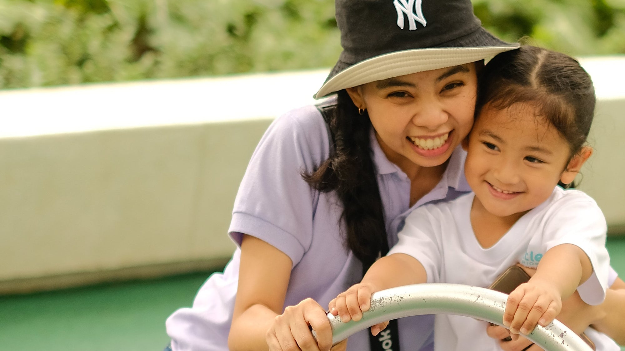 Nursery teacher and student of Little Warriors Preschool having fun at the playground at Ayala Triangle Makati City.