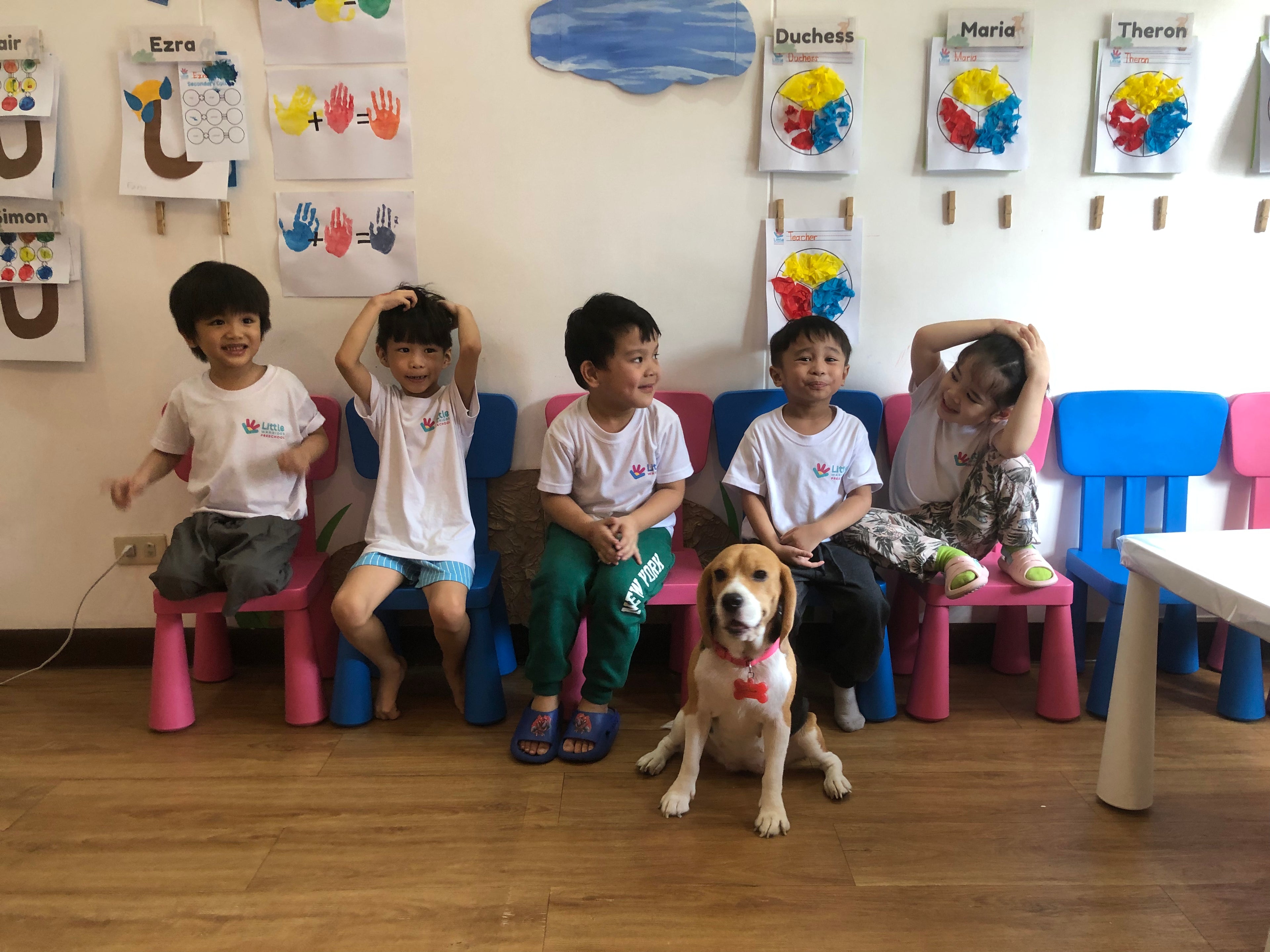Little Warriors Preschool Pre-Nursery / Nursery students pose for a class picture at the classroom. Children smiling and having fun while learning.